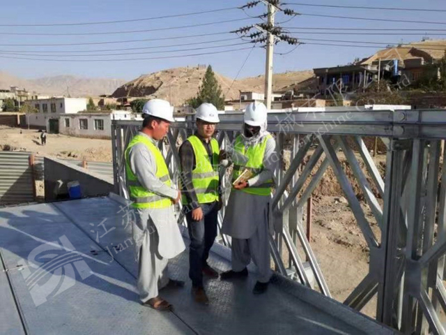 Engineers inspecting modular steel bridge deck for special mission access