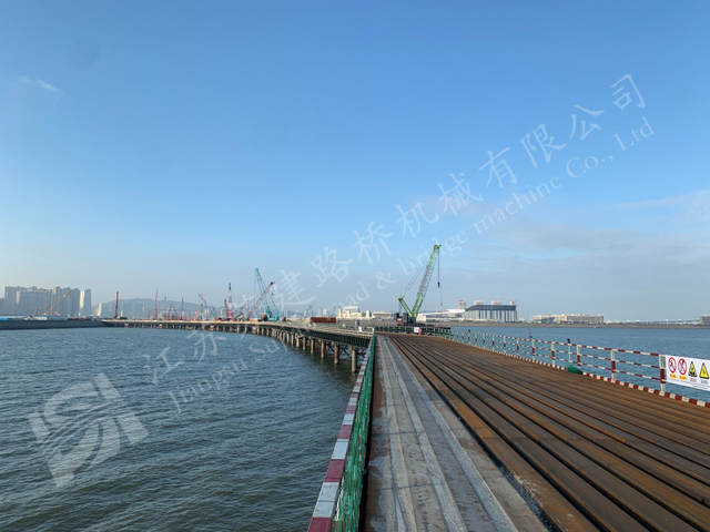Industrial steel access bridge over sea for coastal infrastructure construction