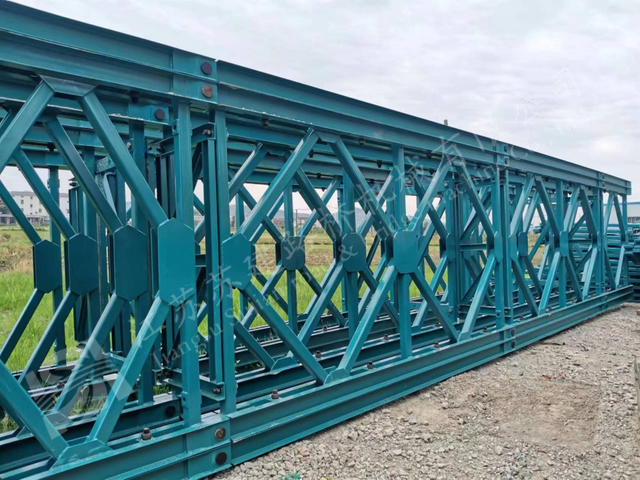 Teal prefabricated truss bridge for durable public infrastructure access