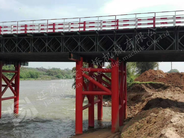 Bailey bridge construction over river for disaster relief and emergency connectivity