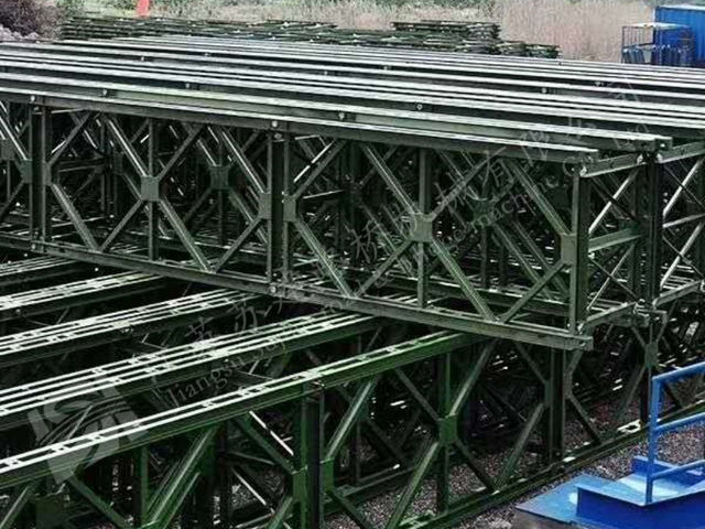 Stacked Bailey bridge truss frames ready for custom steel bridge projects